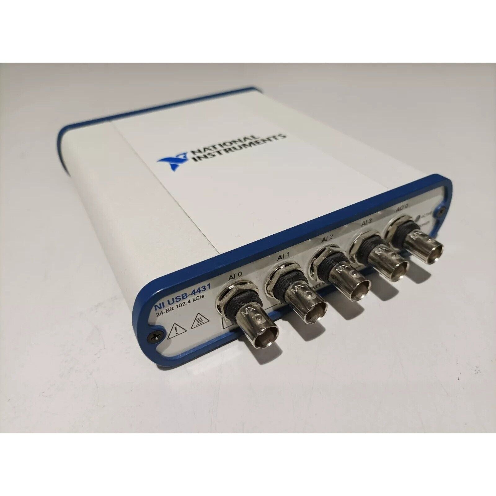National Instruments USB-4431 data acquisition device. White and blue device with BNC connectors for sound and vibration.