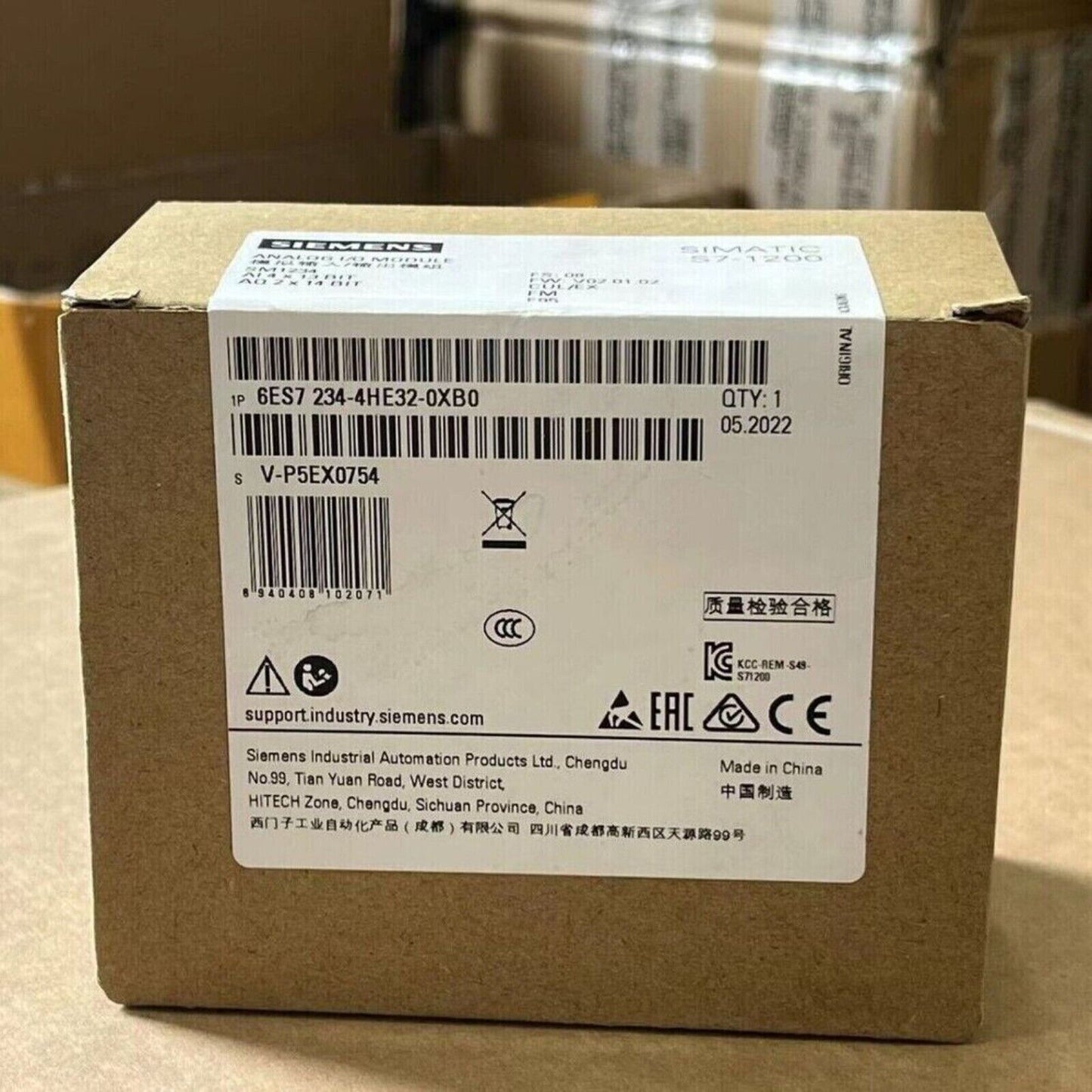 SIMATIC S7-1200 analog I/O module 6ES7234-4HE32-0XB0 on box. Industrial automation part with 4 AI, 2 AO.