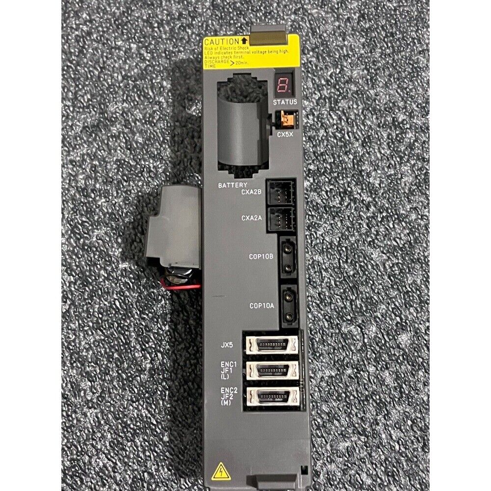 FANUC A20B-2101-0041 servo motor drive control board, with Caution warning, STATUS, and connector labels