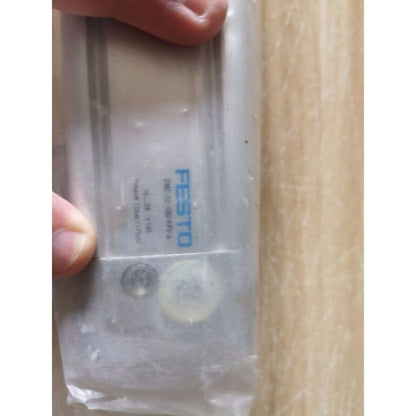 FESTO DNC-32-100-PPV-A pneumatic actuator in packaging, industrial automation component