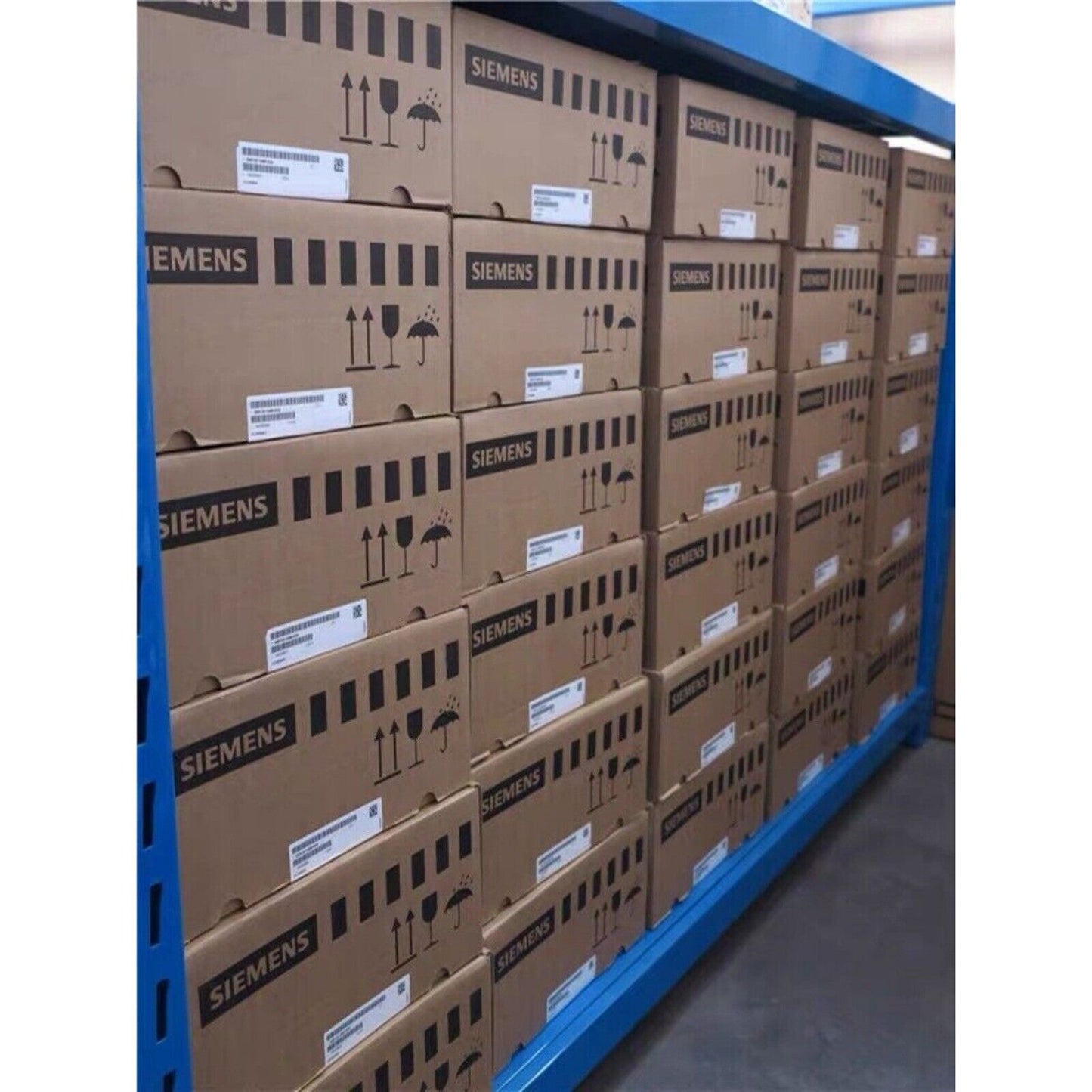 Siemens PLC Power Blocks in warehouse storage on blue shelving, ready for shipment.