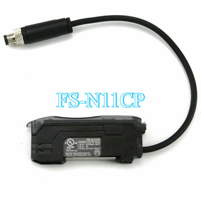 Keyence FS-N11CP Fiber Optic Sensor, black housing with cable and connector, industrial automation part.
