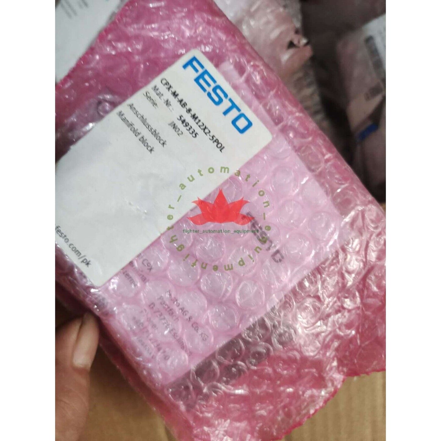 Festo CPX-M-AB-8-M12X2-5POL Manifold Module in pink protective packaging, industrial automation component.