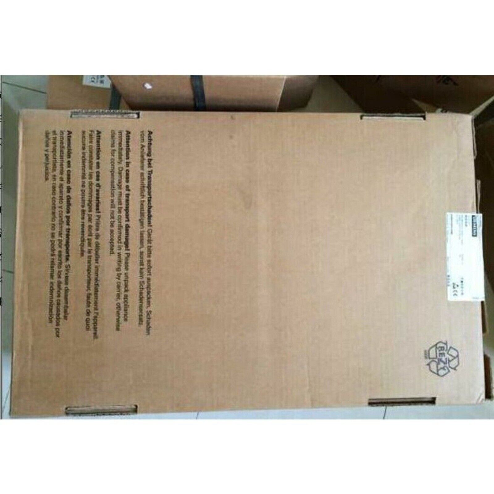 Siemens PLC Module shipping box with warning text.