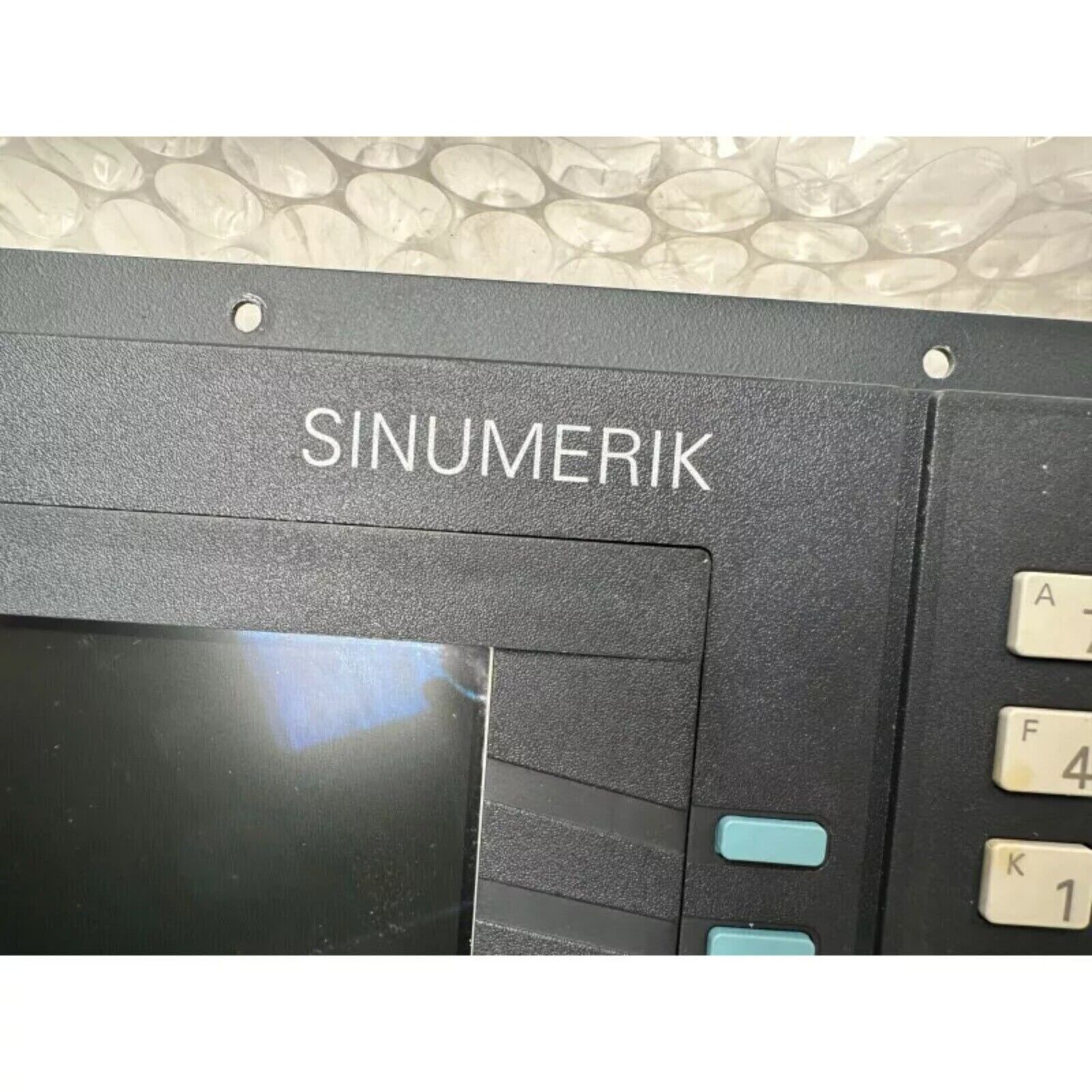 Siemens SINUMERIK operator panel with buttons and screen, industrial automation part