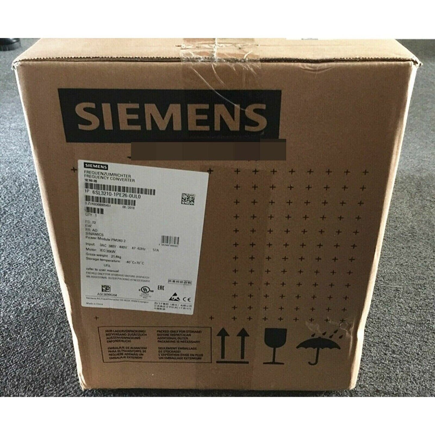 Siemens SINAMICS G120 Power Module 6SL3210-1PE26-0UL0 in shipping box, industrial drive component.