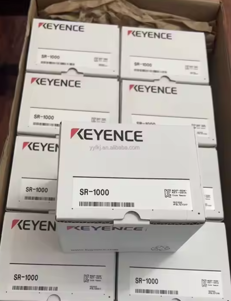Keyence SR-1000 code reader boxes in a shipping container, industrial automation parts.