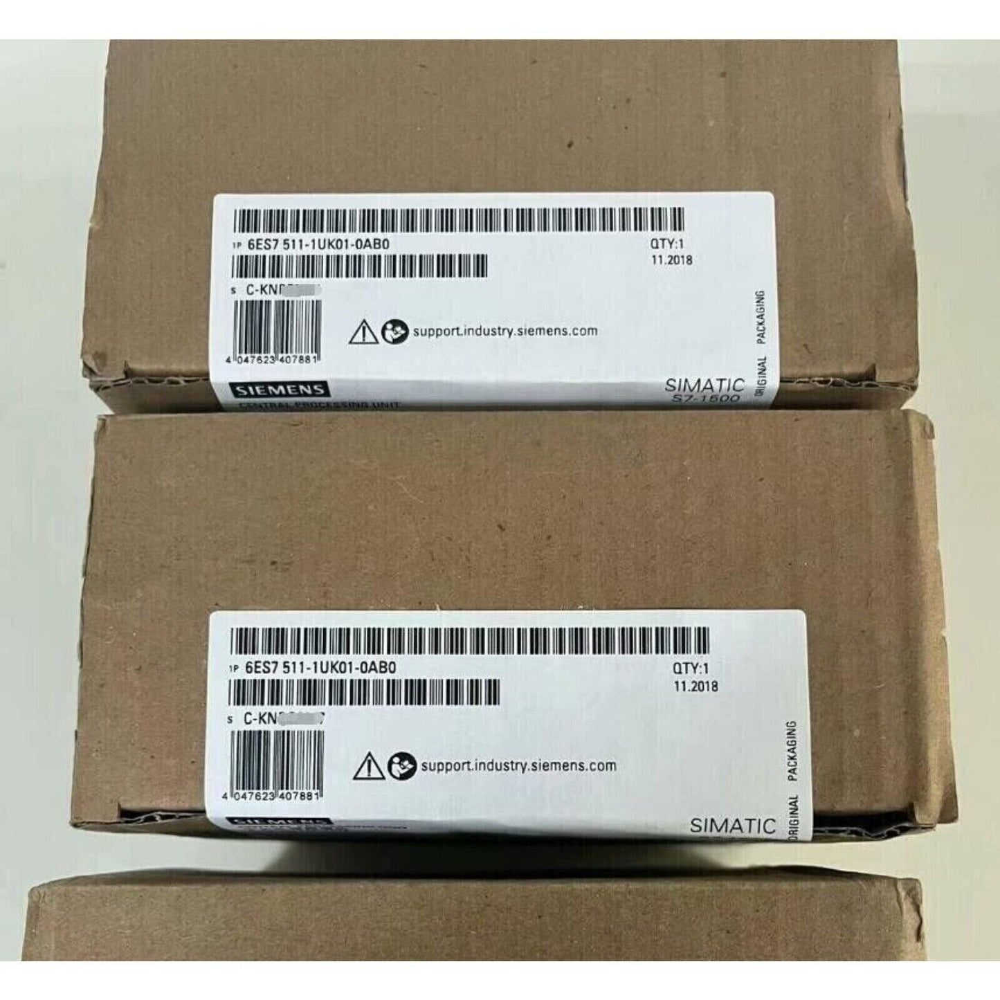 Siemens S7-1500 CPU 6ES7 511-1UK01-0AB0 packaging, industrial automation part, original packaging, and product label.