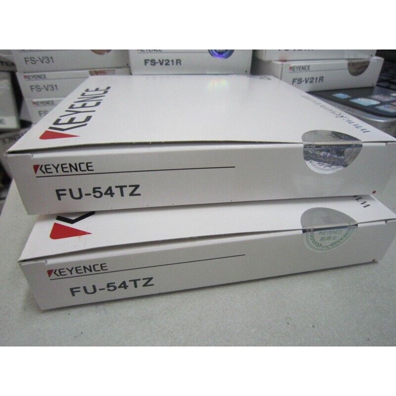 Keyence FU-54TZ fiber amplifier sensor boxes, new in box, featuring the Keyence logo and model number.