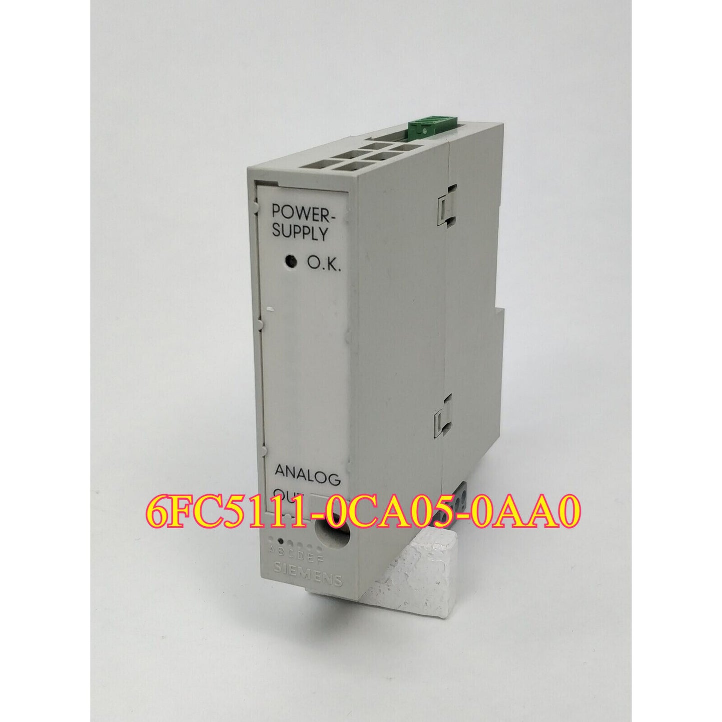 Siemens 6FC5111-0CA05-0AA0 SINUMERIK DMP ANALOG OUT PLC module, industrial automation part, grey with green connectors.