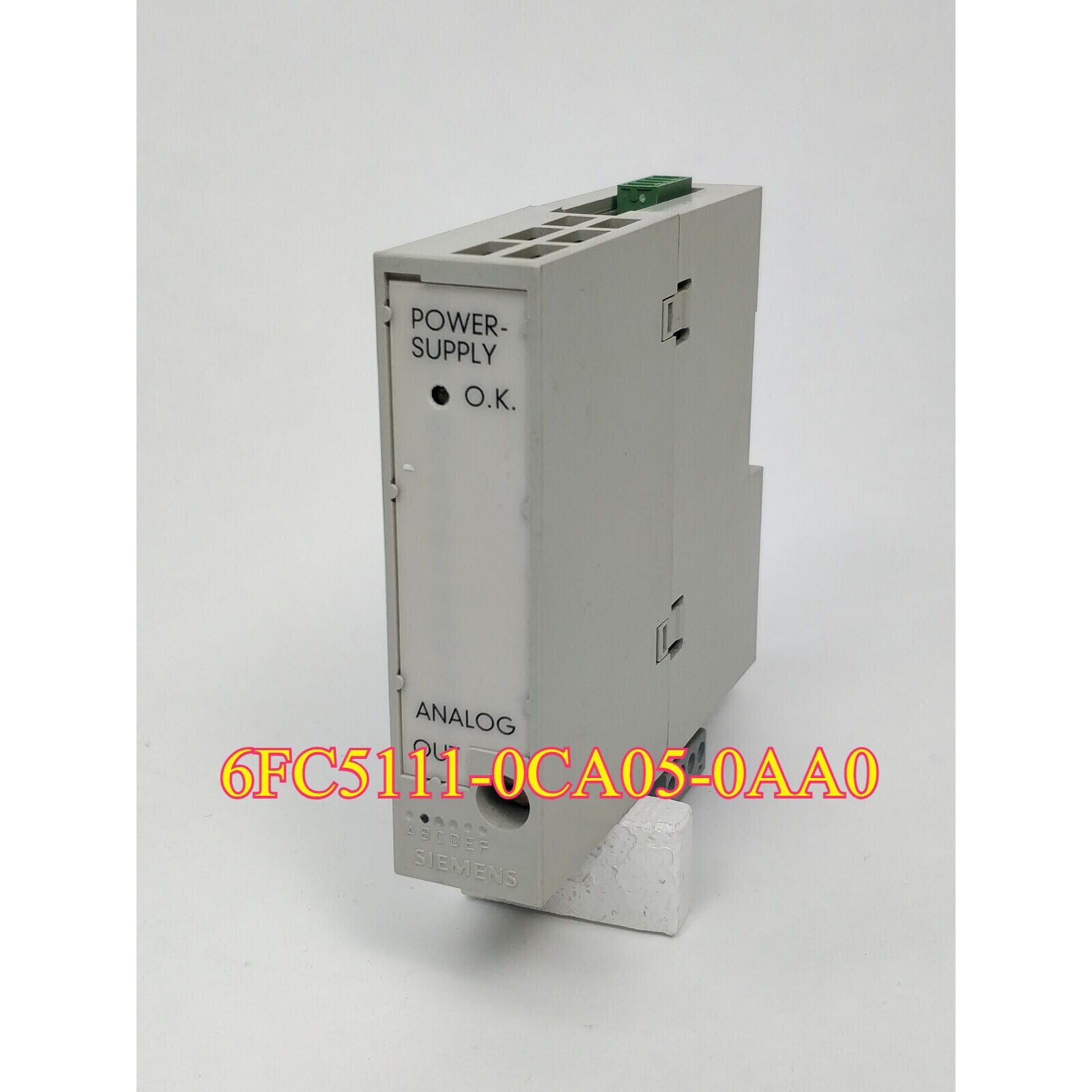 Siemens 6FC5111-0CA05-0AA0 SINUMERIK DMP ANALOG OUT PLC module, industrial automation part, grey with green connectors.