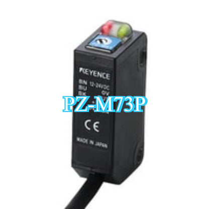 KEYENCE PZ-M73P photoelectric sensor, new in box. Black sensor with visible LED indicators, industrial automation equipment.