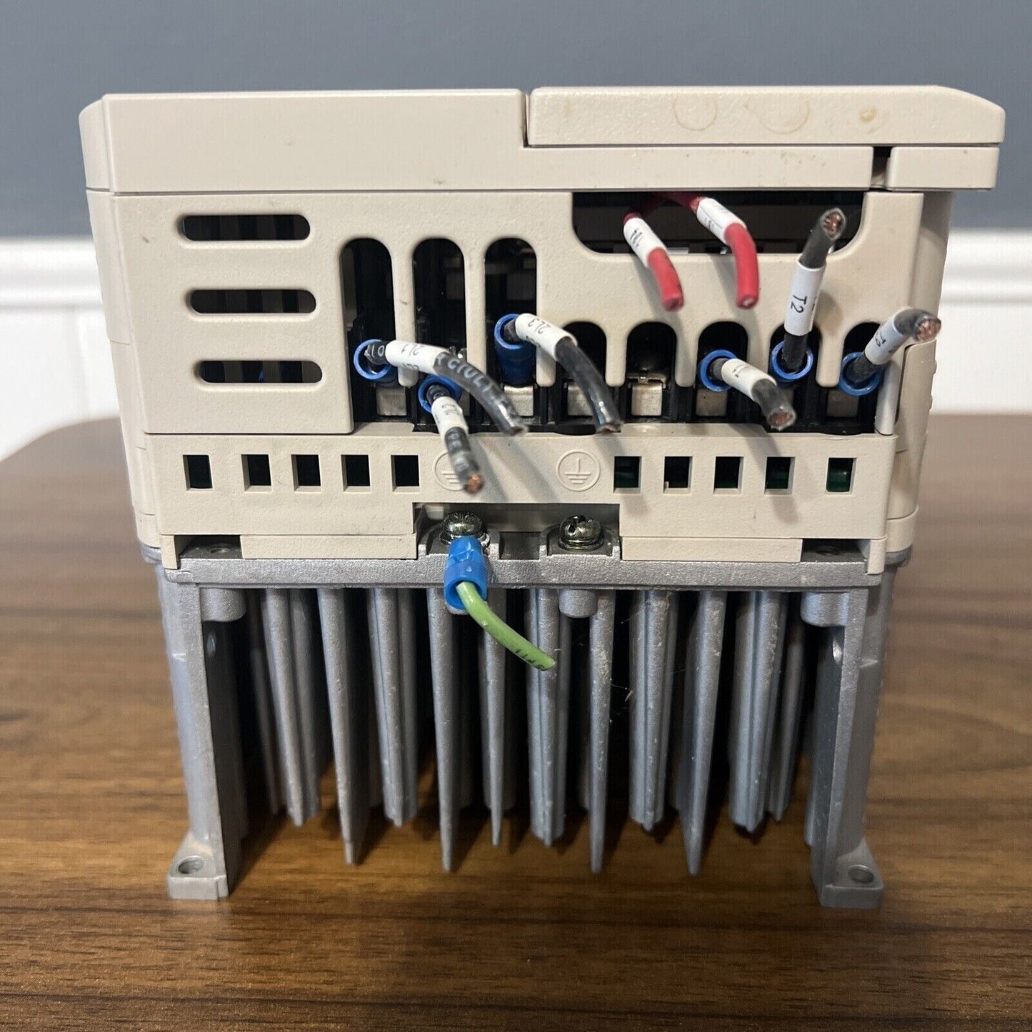Yaskawa CIMR-JU4A0011BAA variable frequency drive wiring, industrial automation. Labeled terminals and connected wires.