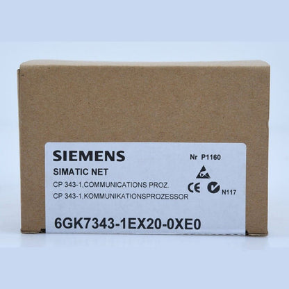 Siemens SIMATIC NET CP 343-1 PLC module 6GK7343-1EX20-0XE0 on a brown cardboard box, industrial automation part.
