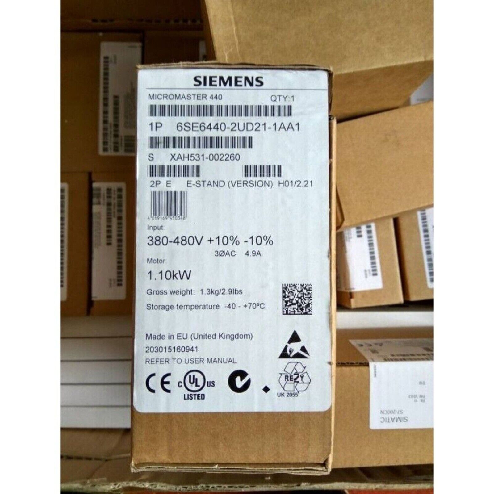 Siemens MICROMASTER 440 VFD box, model 6SE6440-2UD21-1AA1, 1.10kW motor, in a warehouse setting.