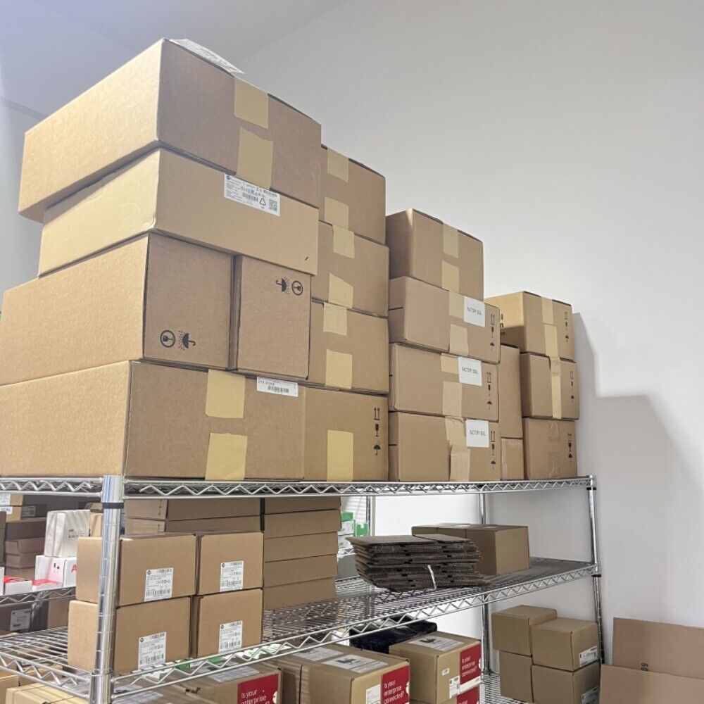 Stacked cardboard boxes on industrial shelving, ready for shipping.