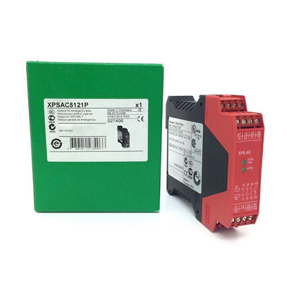 Schneider XPSAC5121P safety relay module, red/black, industrial automation component for emergency stop.
