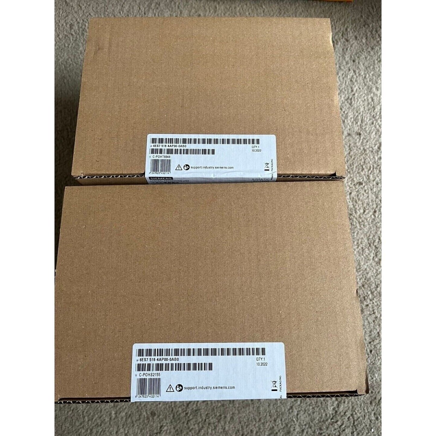 Siemens S7-1500 PLC CPU in brown cardboard box packaging, model 6ES7 518-4AP00-0AB0, QTY 1.