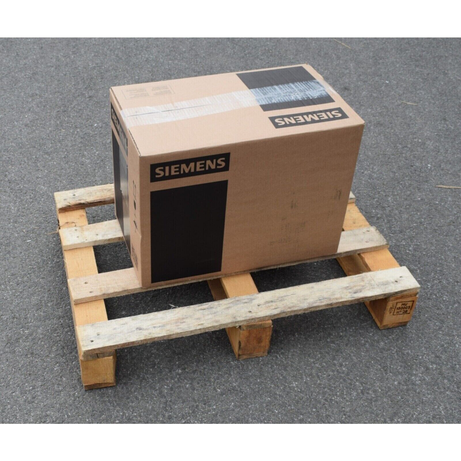 Siemens industrial automation equipment box on wooden pallet. Industrial parts.