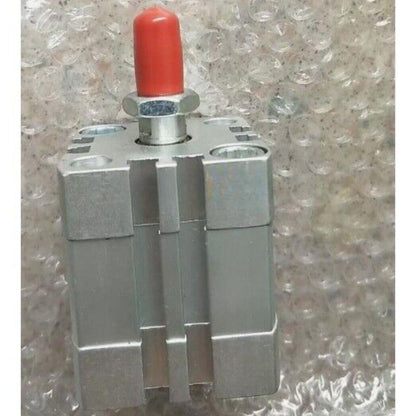 FESTO ADN-32-10-A-P-A cylinder. Silver pneumatic cylinder with red cap, industrial automation part.
