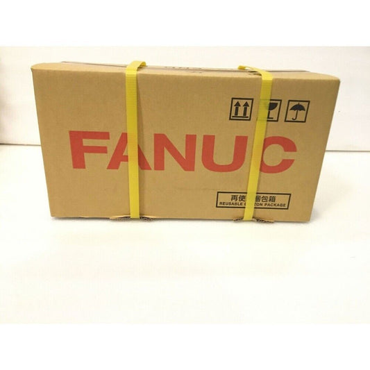 FANUC servo motor packaging with shipping labels. Brand new industrial automation part.