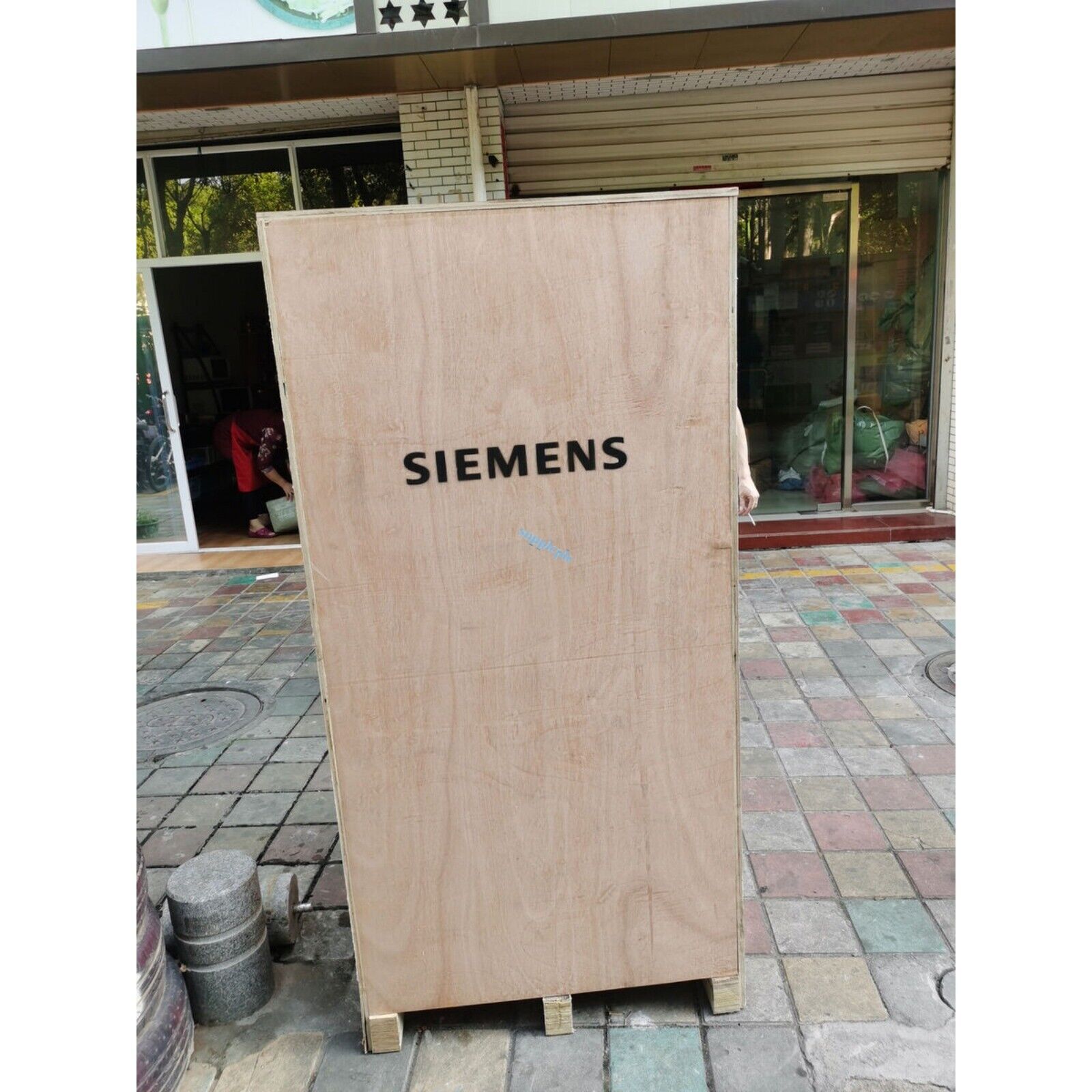 Siemens equipment wooden shipping crate, exterior shop view, industrial automation parts.
