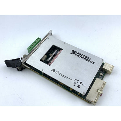 National Instruments PXI-4132 SMU Module, silver metal component with green connectors, electronics.