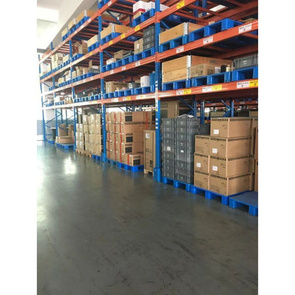 Warehouse storage of Siemens industrial automation parts, boxes on blue pallets. Inventory.