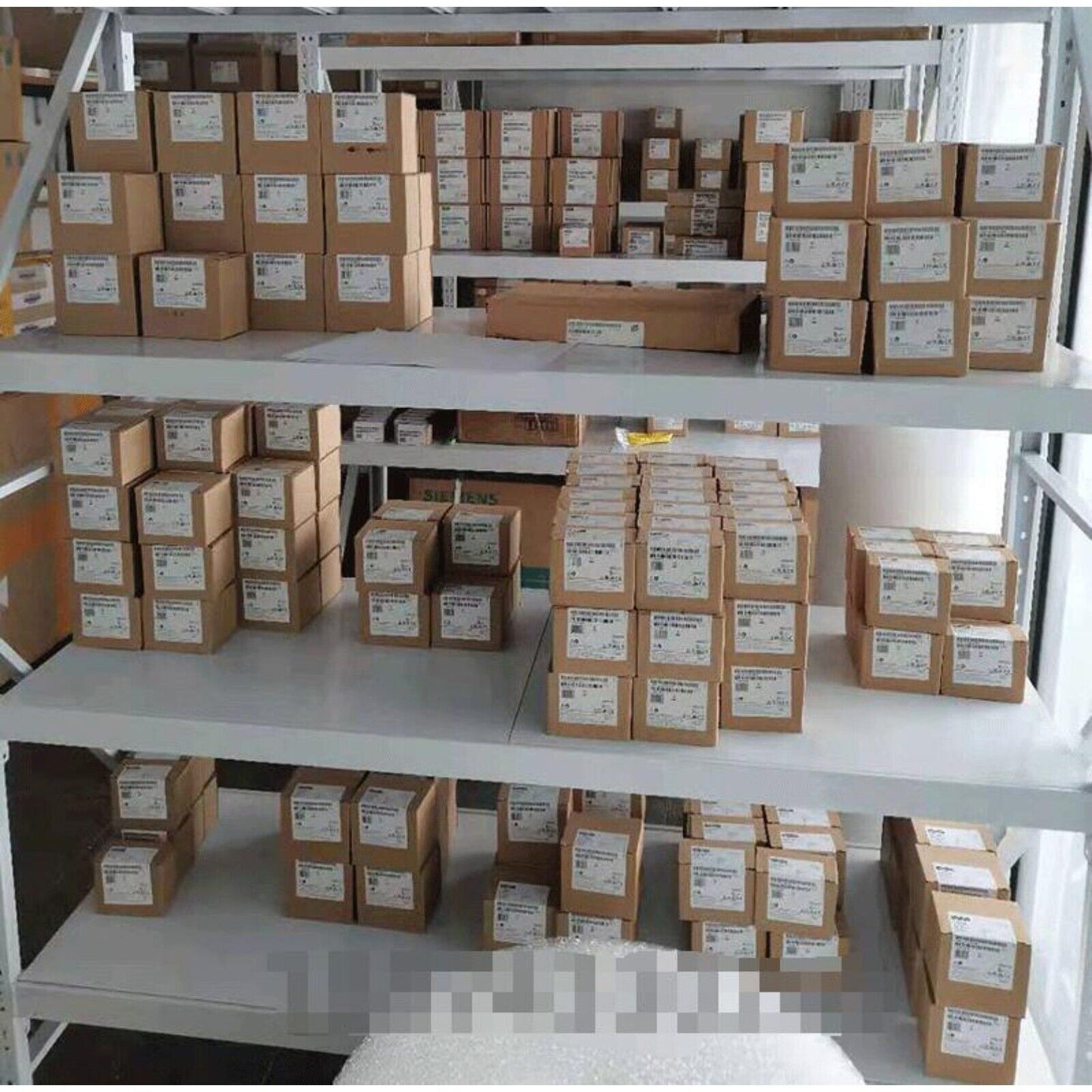 Siemens PLCs and industrial automation parts on warehouse shelves, ready for fast shipping.