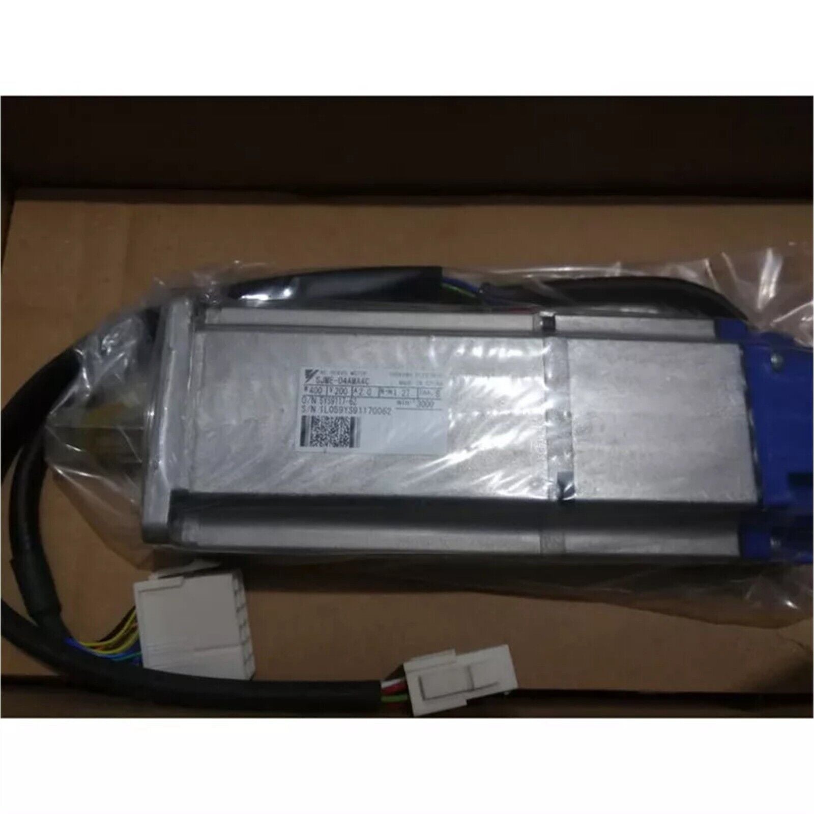 YASKAWA SJME-04AMA4C servo motor, new industrial automation part, silver and blue color, packaged.
