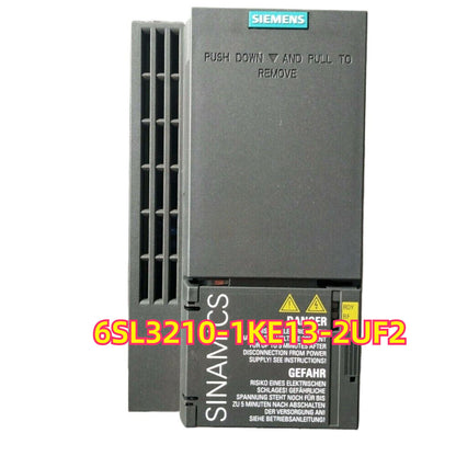 Siemens SINAMICS G120C 6SL3210-1KE13-2UF2 5.5KW Converter, Gray industrial drive with safety warnings.