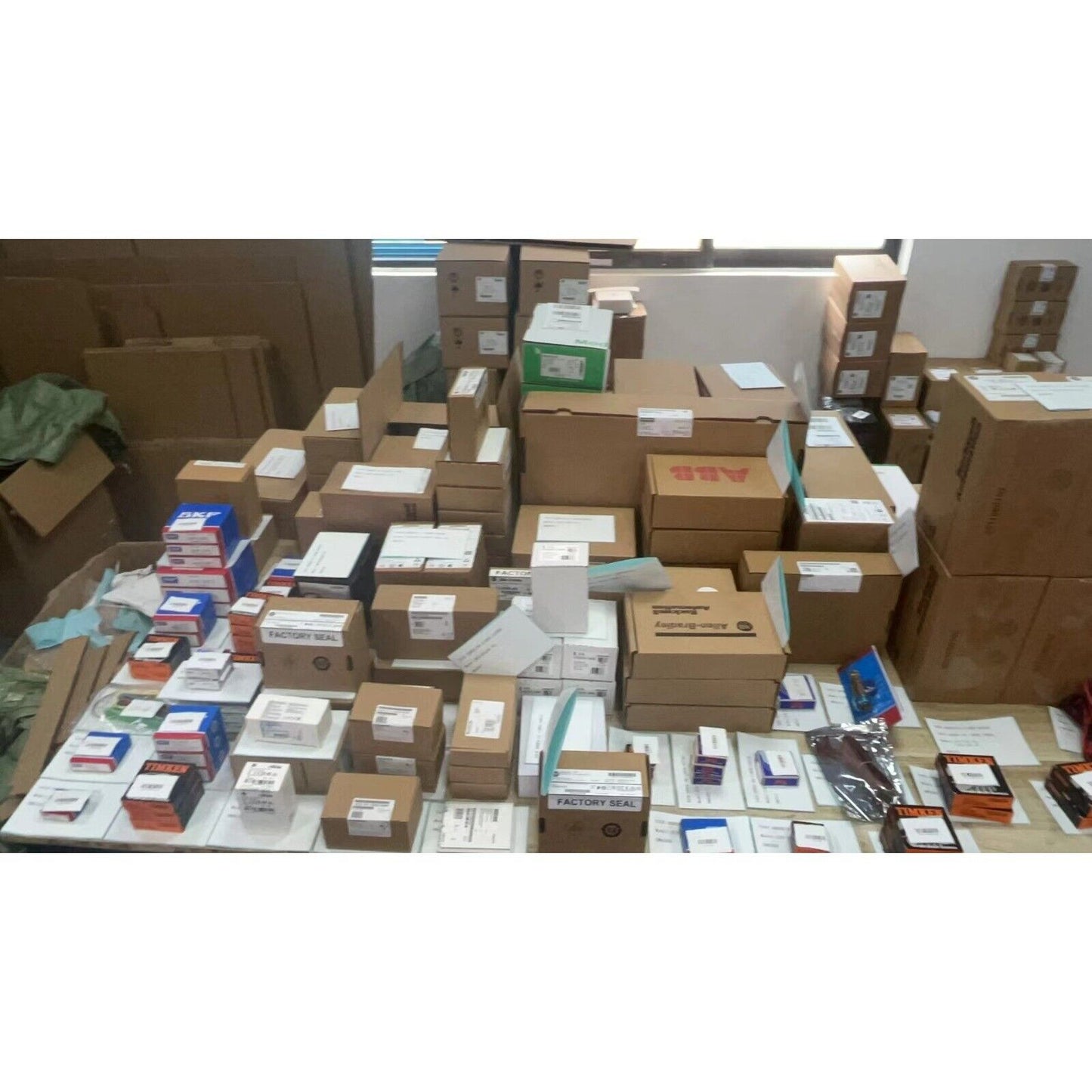Industrial automation parts ready for shipment, including Siemens, Allen-Bradley, and ABB components.