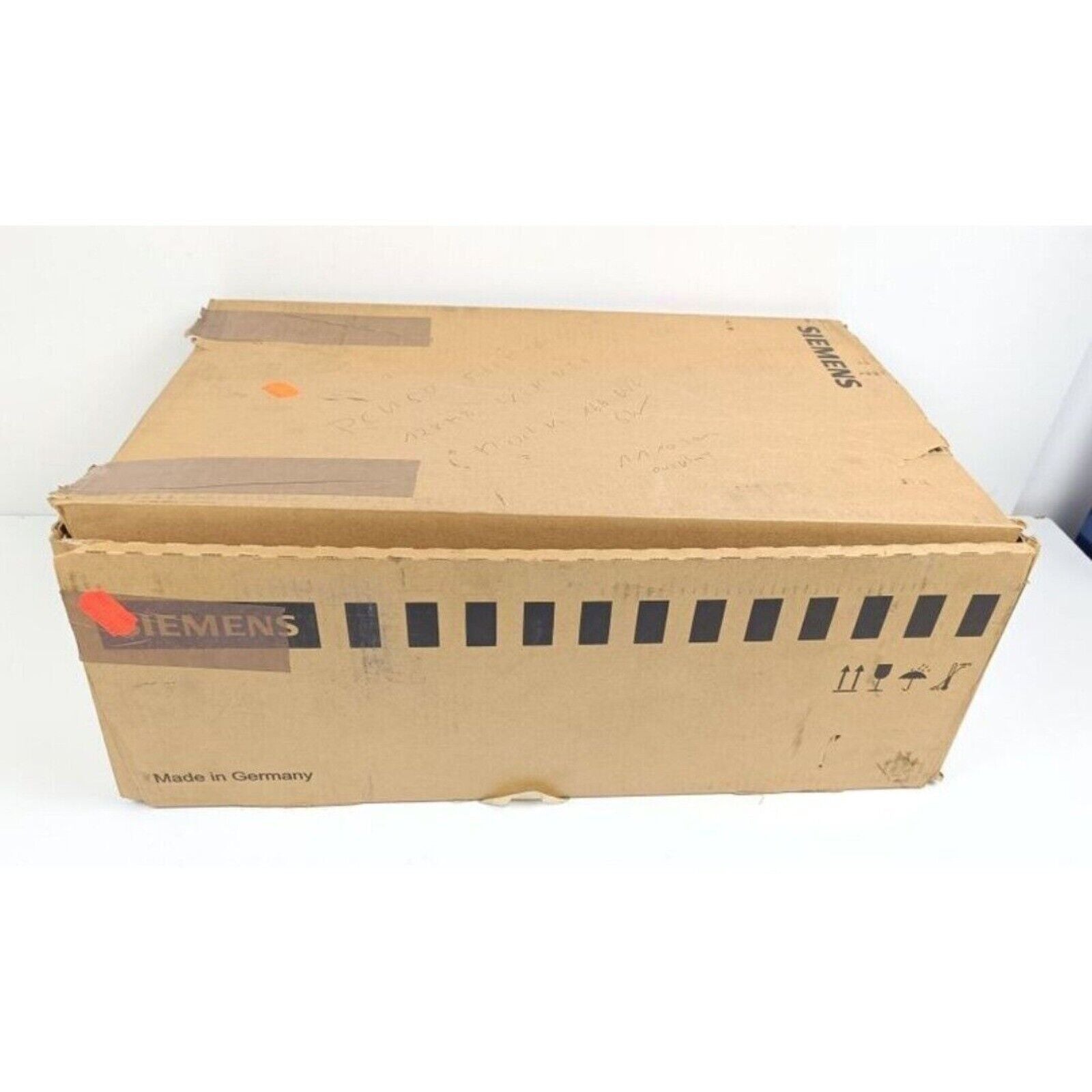 Siemens SINUMERIK PCU 50 shipping box. Brown cardboard packaging, Made in Germany.