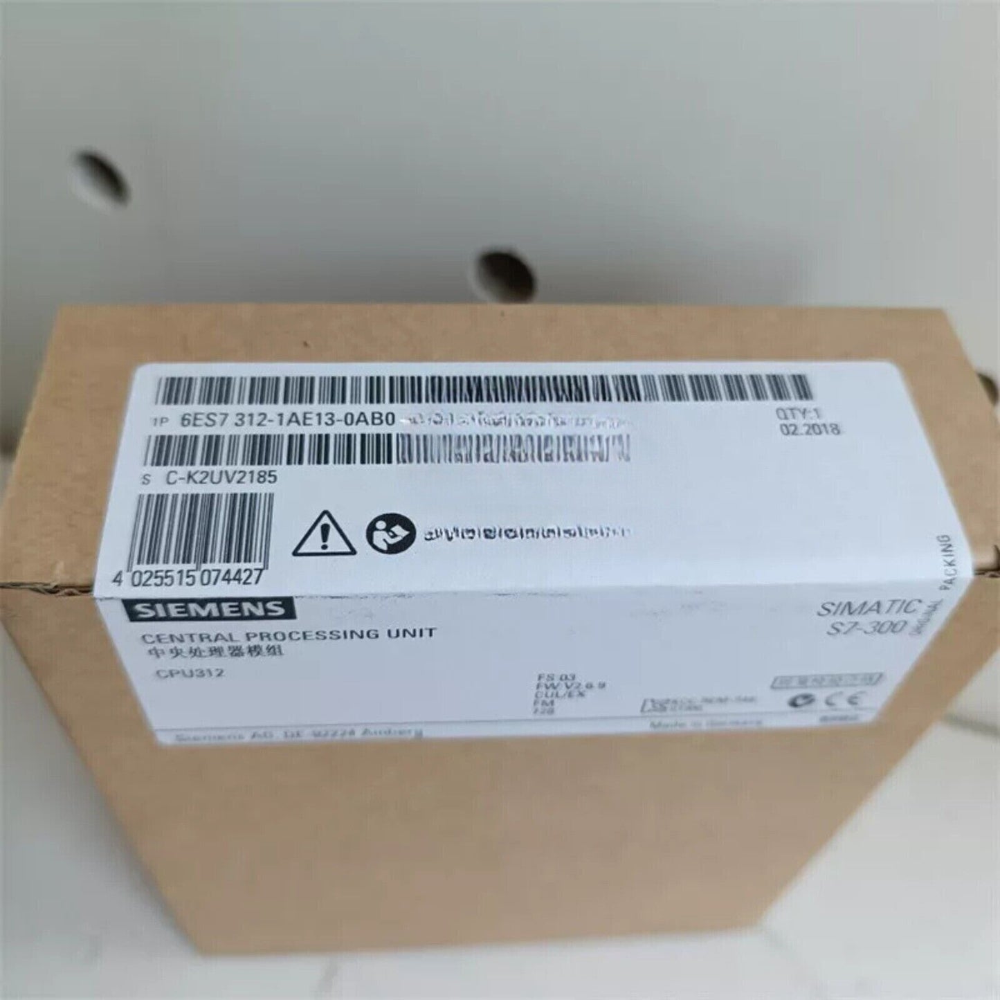Siemens SIMATIC S7-300 CPU 312 in packaging, industrial automation part.
