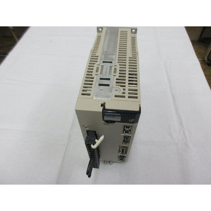 Yaskawa SGD7S-7R6A20A Servopack servo drive, unused spare part. Beige housing and industrial automation components.