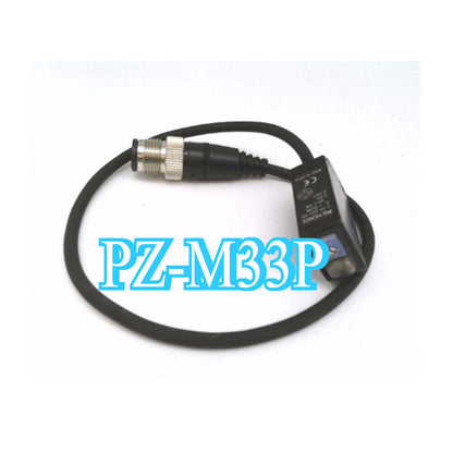 Keyence PZ-M33P Photoelectric Sensor Switch, black sensor with cable and connector, for industrial automation.