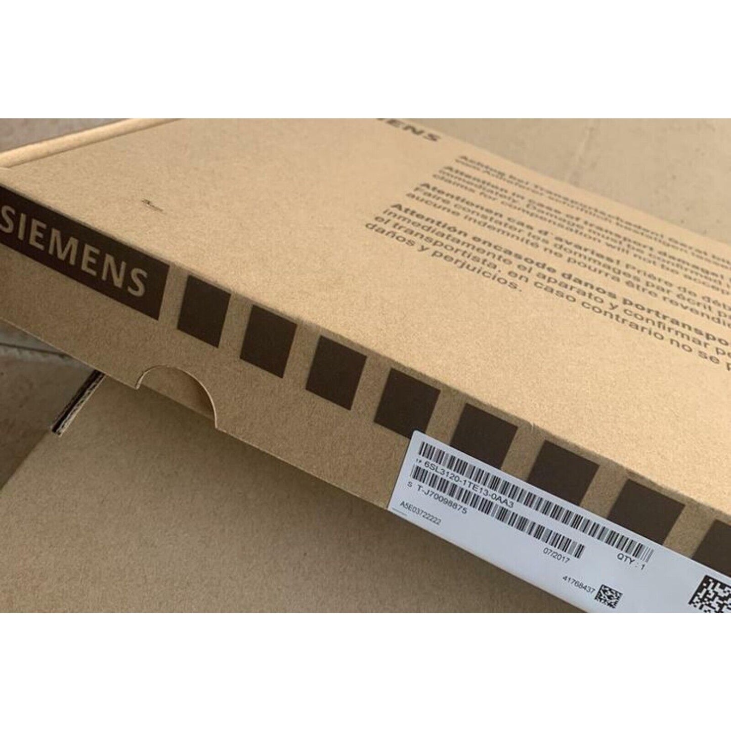Siemens SINAMICS S120 drive box. Brown cardboard. Industrial automation part packaging with product info.