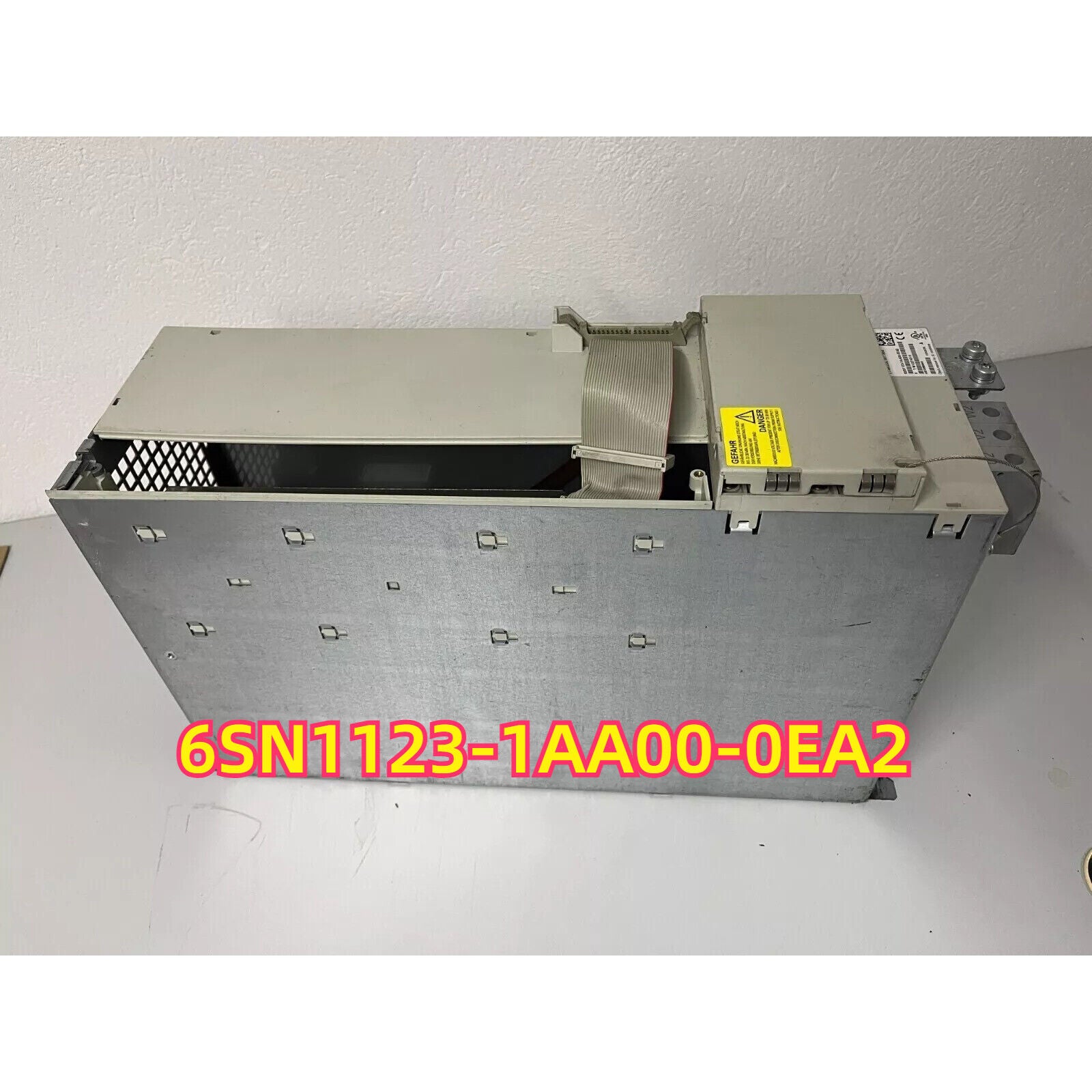 Siemens SINAMICS S120 Modular Drive 6SN1123-1AA00-0EA2 power module, gray metal casing with cable.