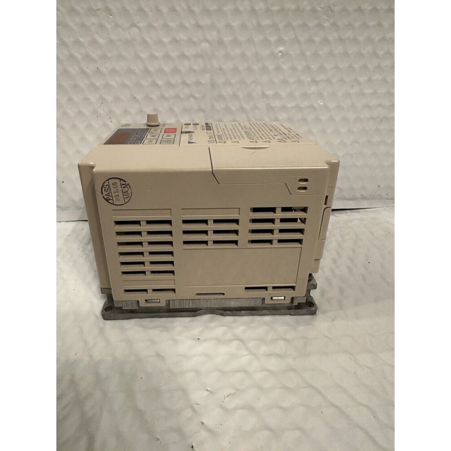 YASKAWA VS mini V7 Inverter Drive, beige industrial automation part, side view. Shows ventilation and control panel details
