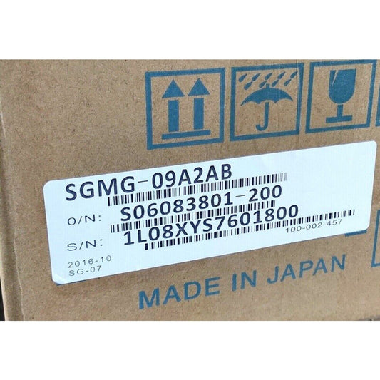 Yaskawa SGMG-09A2AB Servo Motor in box, product label with O/N and S/N information, Made in Japan.