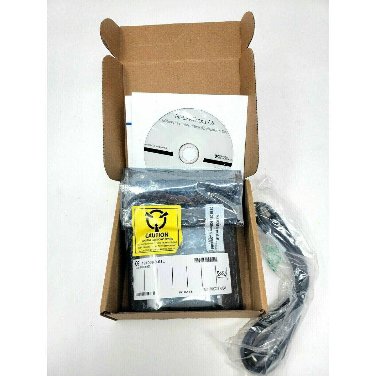 National Instruments USB-6009 I/O device in box with software and cable. Data acquisition equipment.
