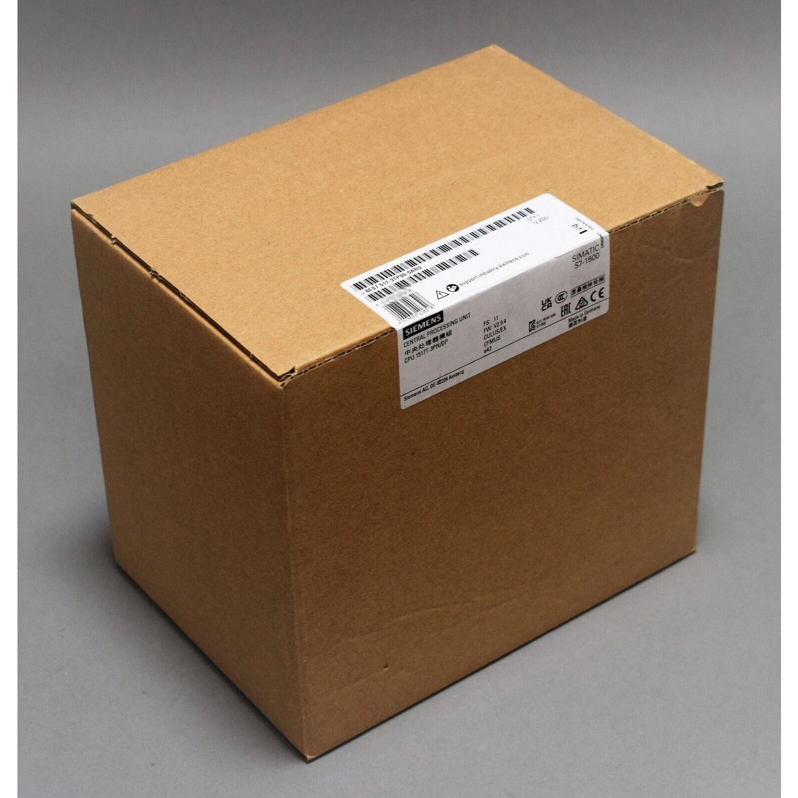 Siemens S7-1500 CPU 1517T-3 PN/DP in a cardboard box. Central Processing Unit module packaging.