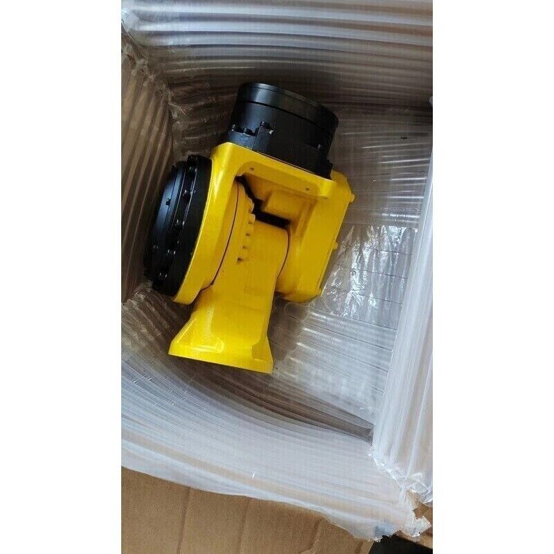 FANUC yellow robot arm component in box, industrial automation parts