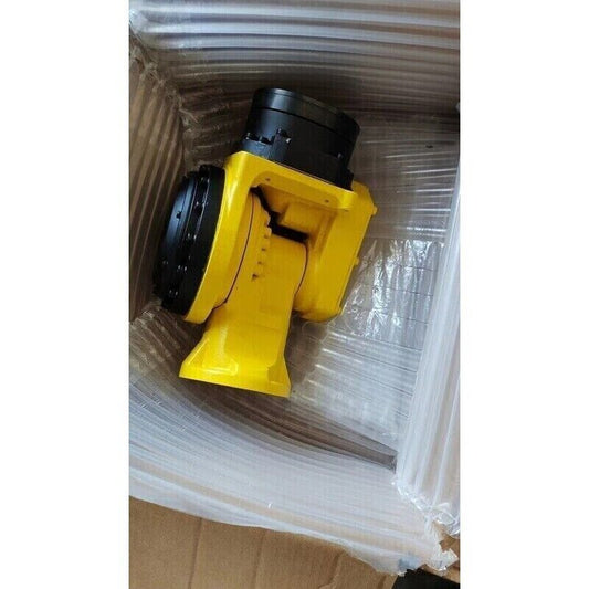 FANUC yellow robot arm component in box, industrial automation parts