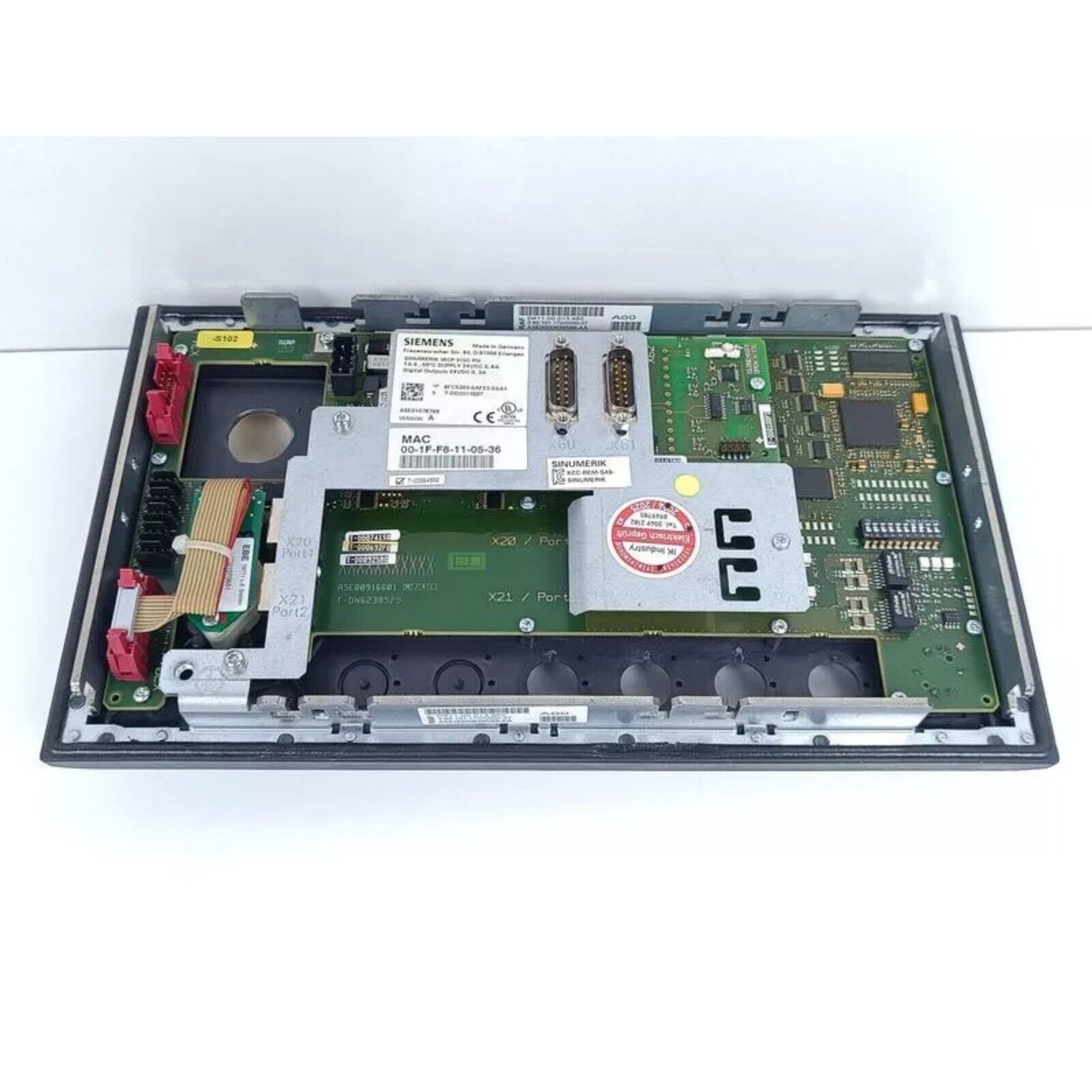 Siemens 6FC5303-0AF23-0AA1 control panel showing internal components, ports, and labels.