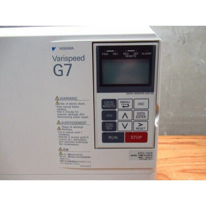 YASKAWA G7 Varispeed drive control panel with LCD screen, buttons and warning labels, 400V-15kW model CIMR-G7A4015