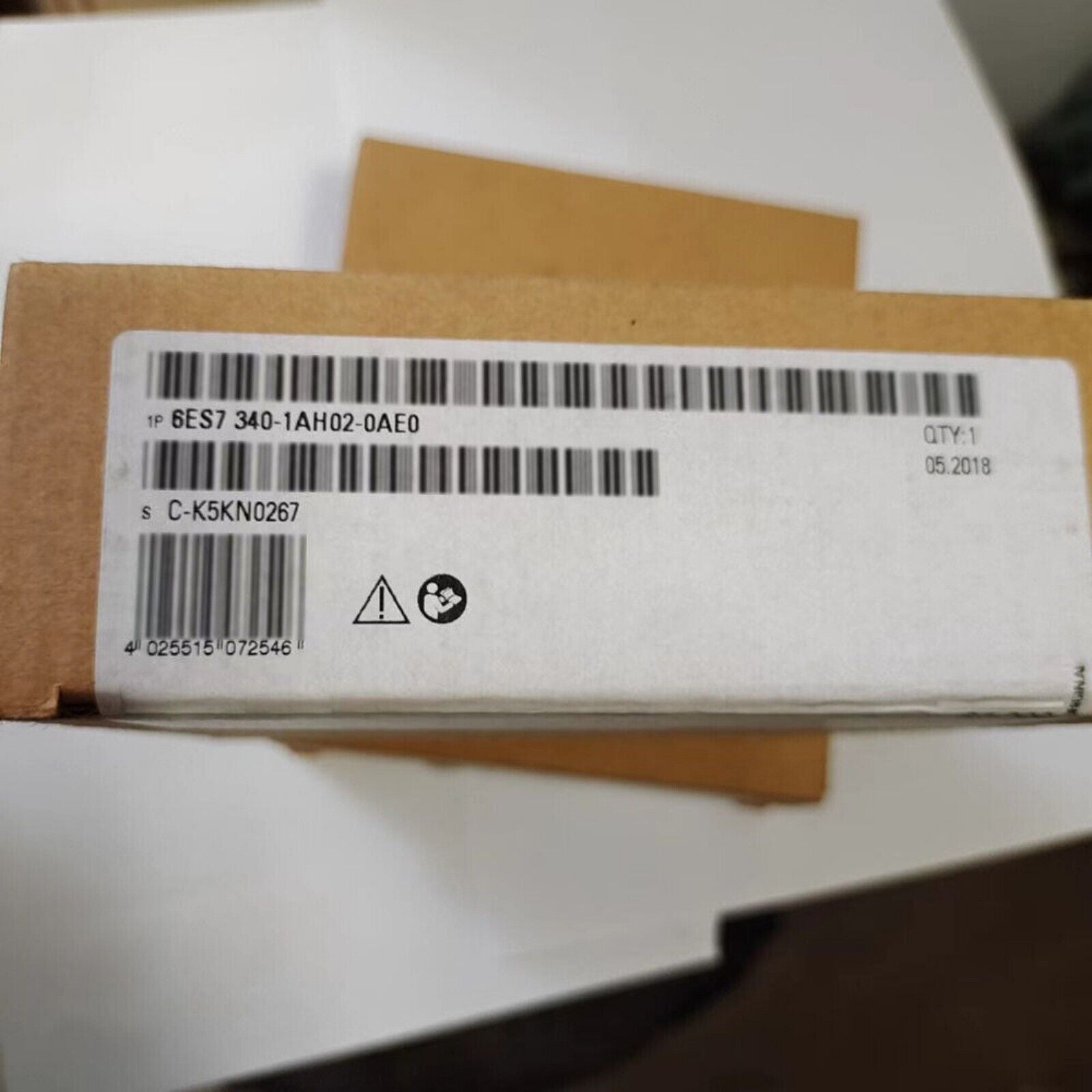 Siemens SIMATIC S7-300 CP 340 PLC module box with product code and date