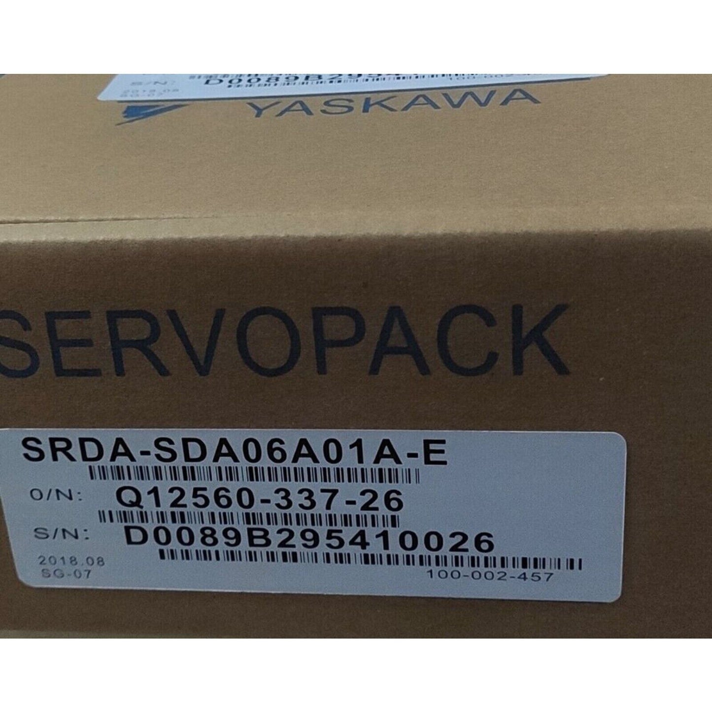 YASKAWA SRDA-SDA06A01A-E Servo Motor packaging, product label visible, industrial automation component.