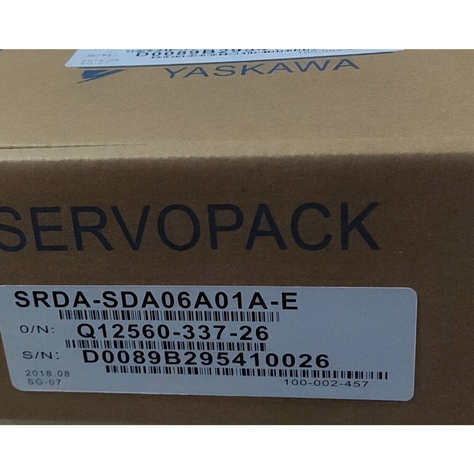 YASKAWA SRDA-SDA06A01A-E Servo Motor packaging, product label visible, industrial automation component.