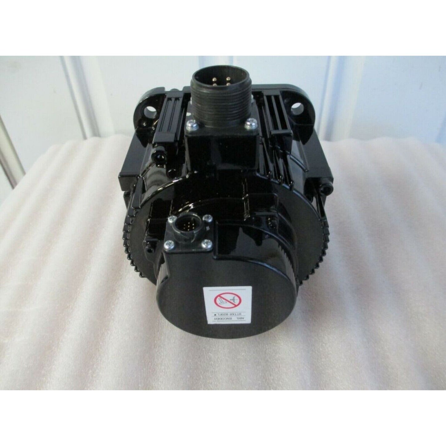 YASKAWA SGMGV-09A3A21 servo motor. Black industrial equipment with connectors, from the front.
